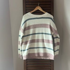 Cream with pink and blue strip crew neck sweater. Size medium.